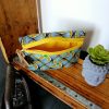 Trousse avec soufflet "façon wax jaune et vert"